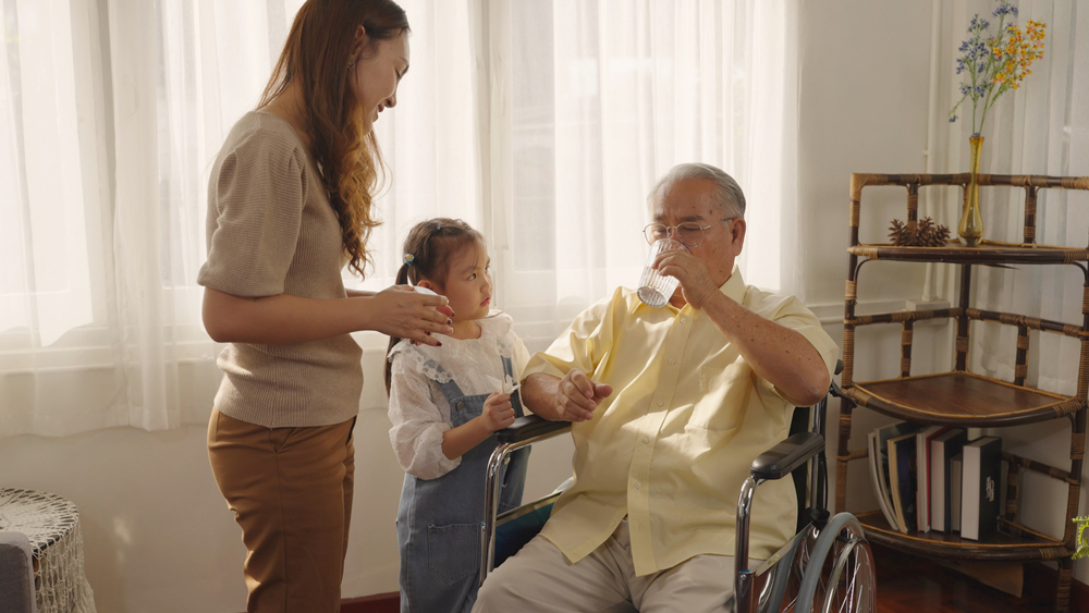 Adult Daughter Caring for Aging Father